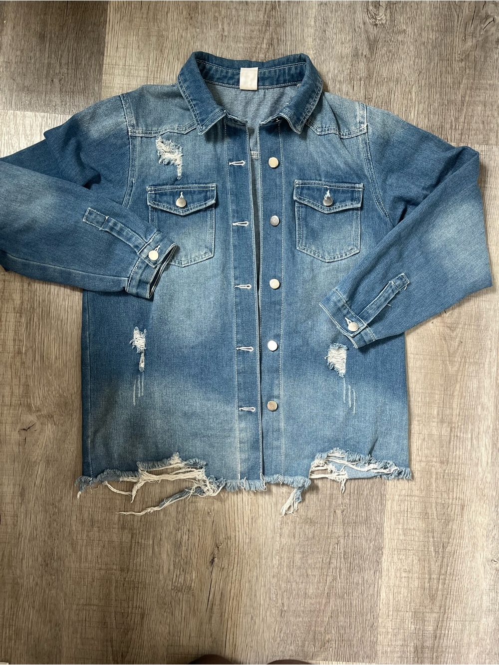 Women's Distressed Blue Denim Jacket with Frayed Hem